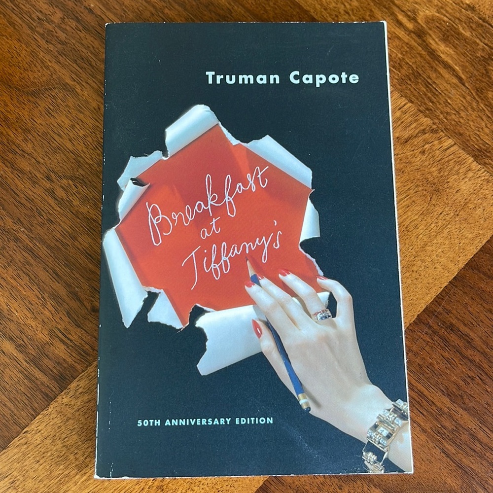 50TH ANNIVERSARY EDITION BREAKFAST AT TIFFANY'S PAPERBACK - TRUMAN CAPOTE